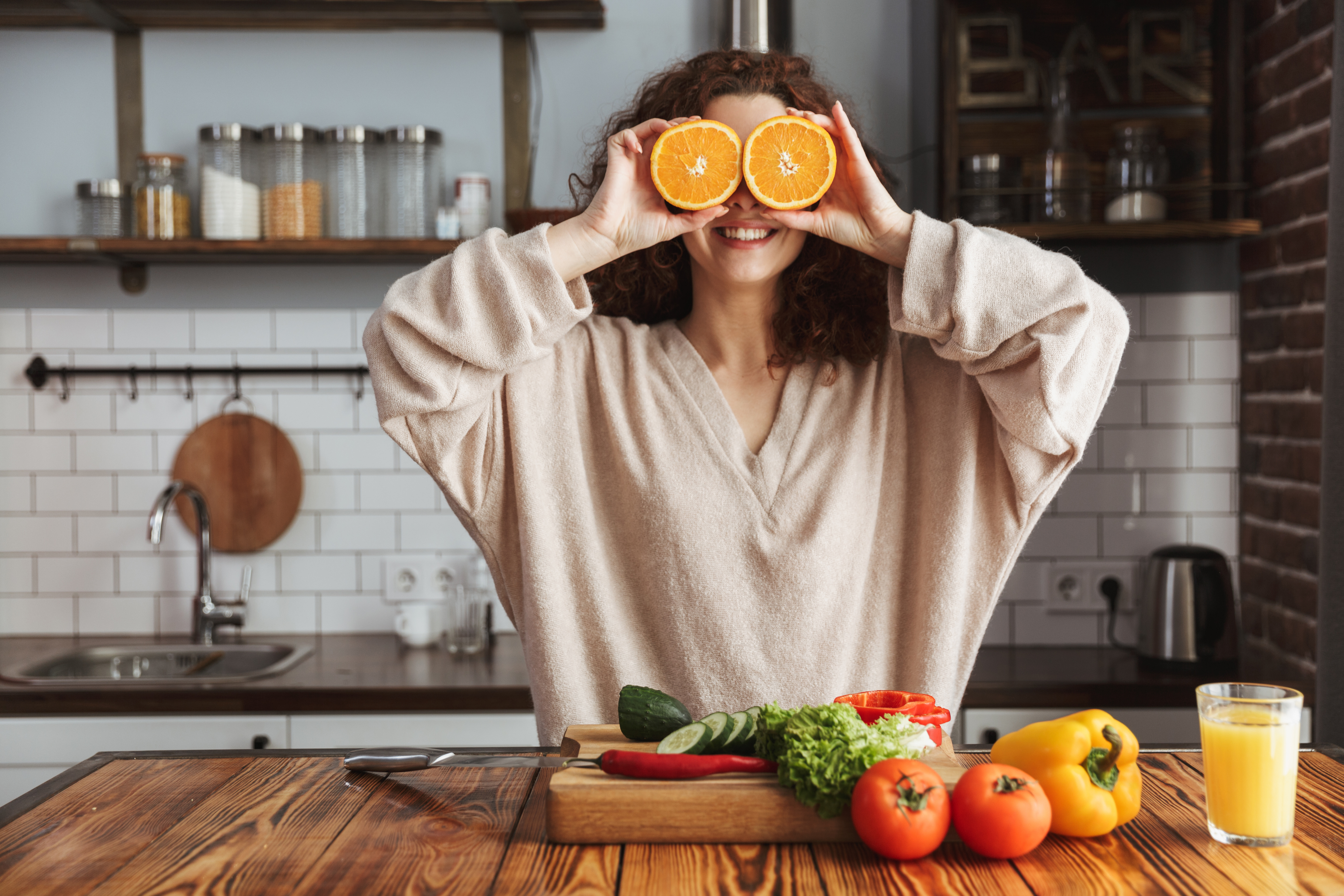 Woman showing oranges