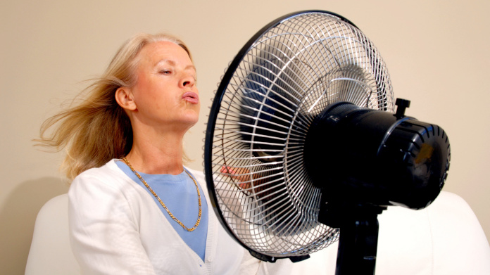 Older woman having a hot flush