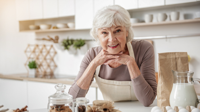 Grandmother making natural remedies in her kitchen